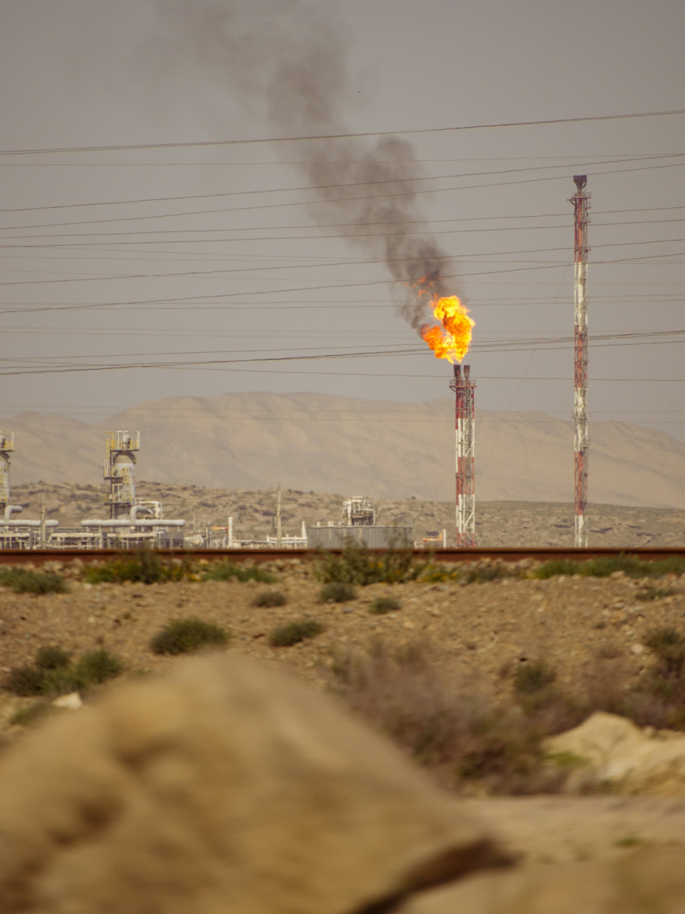 Oil and gas facility with flare stack